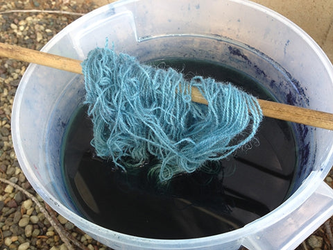 wool yarn in indigo bucket