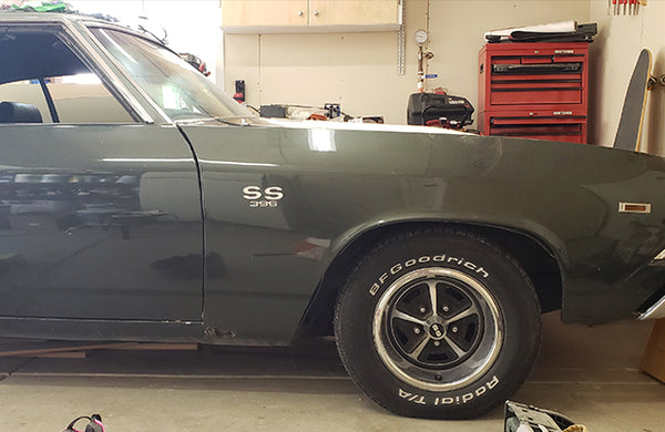 A classic car in a garage.