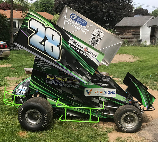 A green and black racing car.