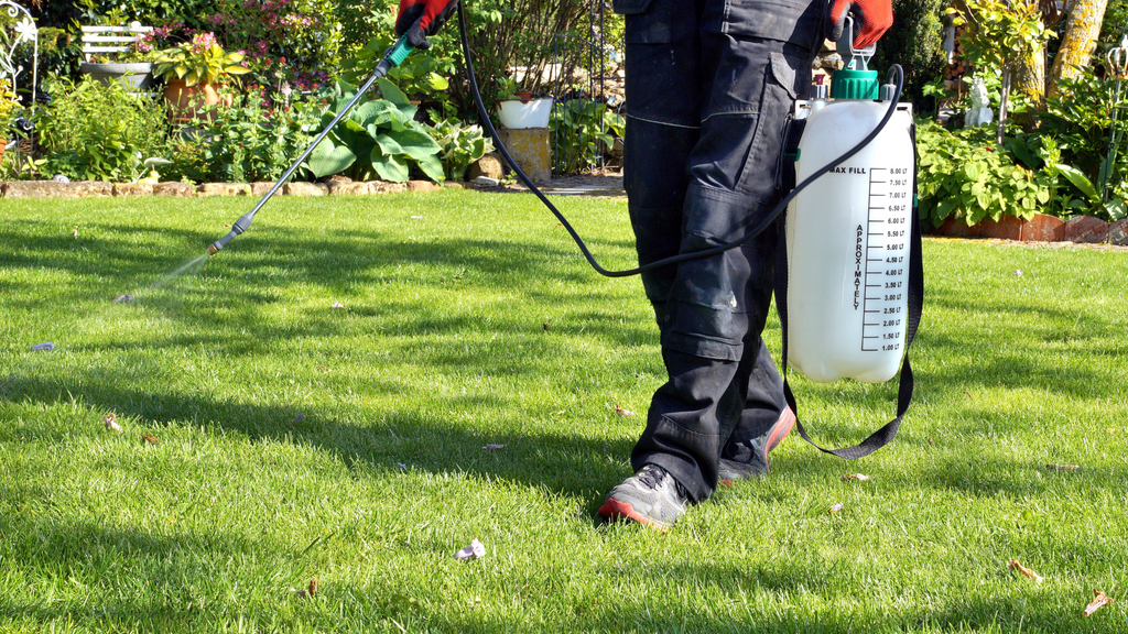 Wallaces Garden Center-Bettendorf-Iowa-spring lawn care-spraying herbicide