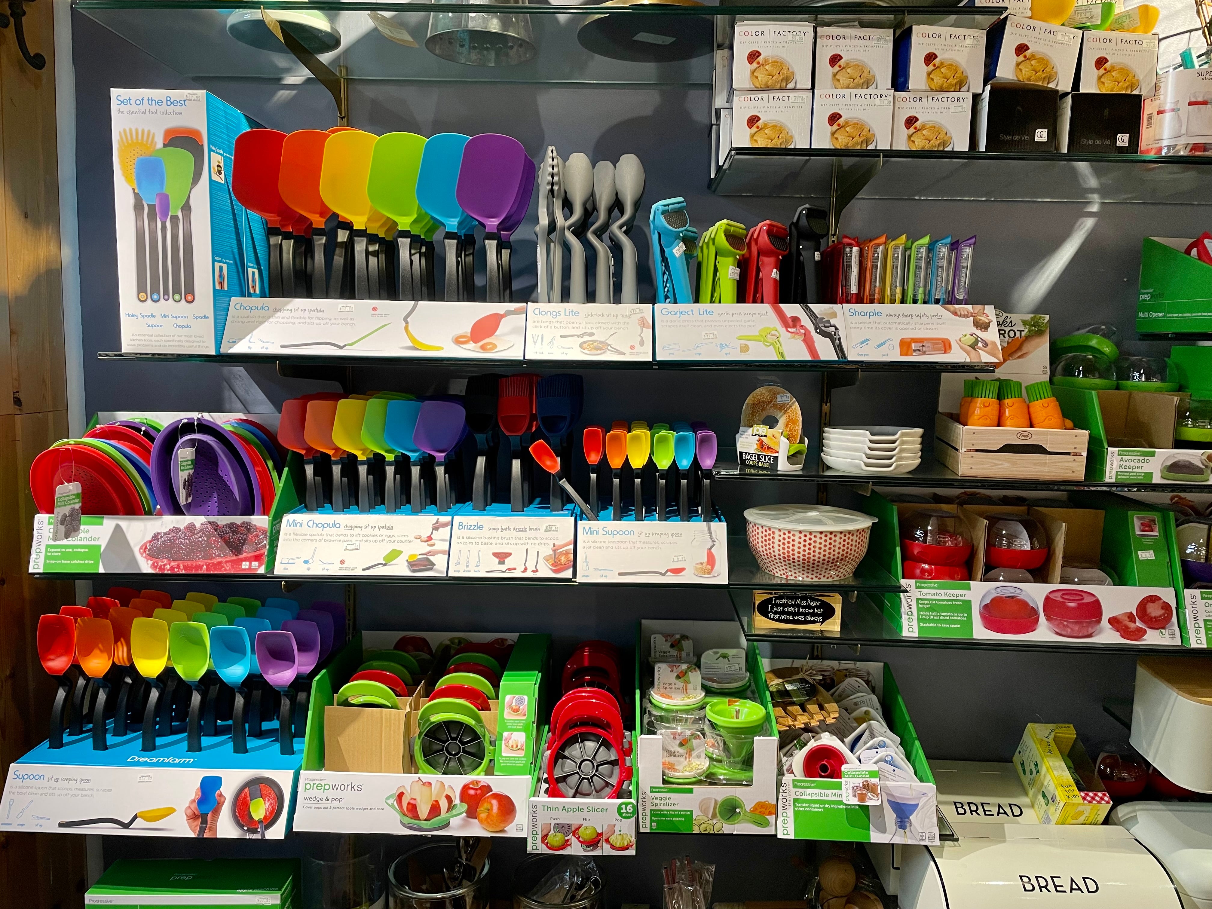 Colorful rainbow of various kitchen utensils and tools