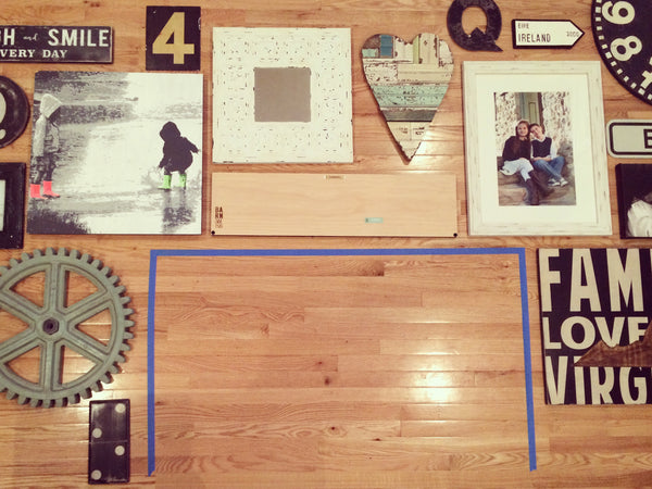 lay out your gallery wall on the floor to make a plan before you start hanging things on the wall.  