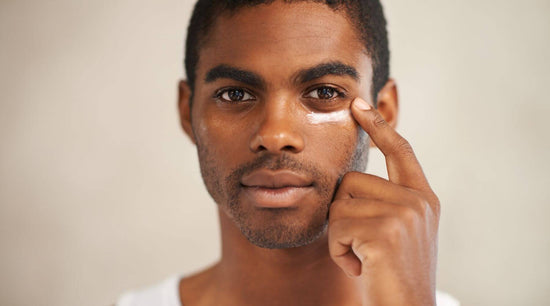 When you should start a men's skincare routine, men applying a face cream