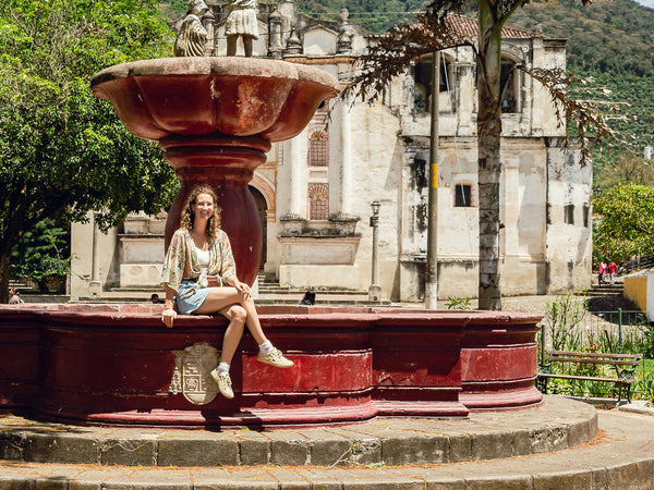 Lucy in Guatemala on a fountain