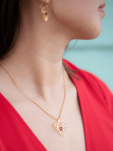 Model wearing Blooming Heart Necklace and Earrings