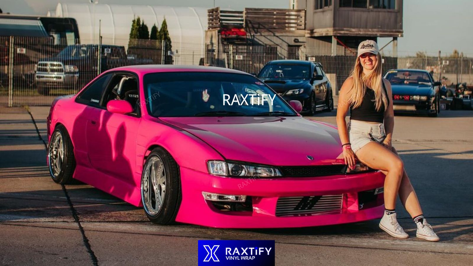 pink-wrapped vehicles alongside glamorous backdrops or fashion-forward