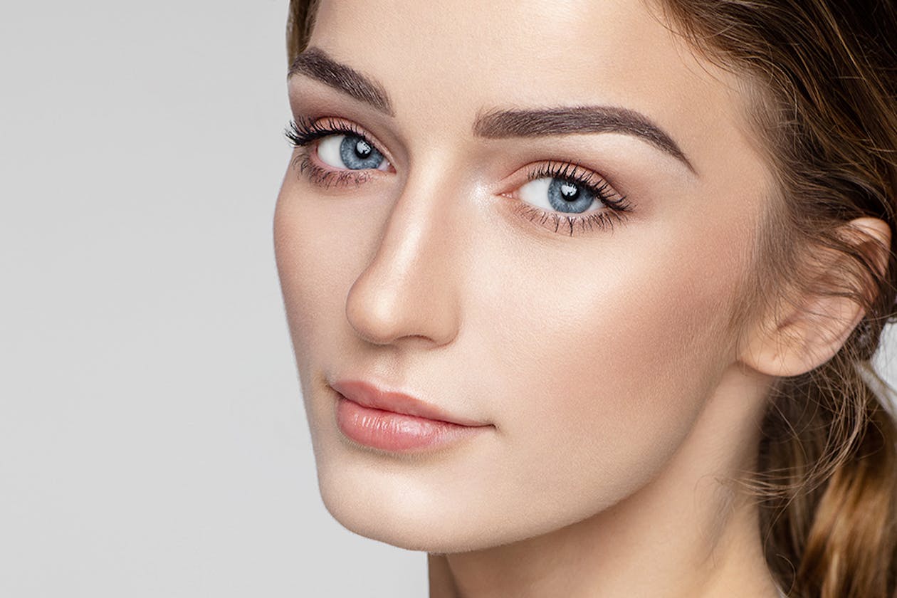 a woman with 'Natural' lash style, exemplifying a subtle and understated look, suitable for those who prefer a more organic and less dramatic appearance in lash styles