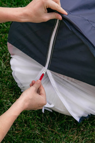 Zipping the mosquito mesh on to the DockATot Cabana Kit