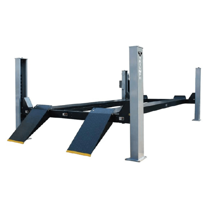 Oblique view of the Triumph NTR-16 Vehicle Lift, showcasing reinforced steel posts, non-slip ramp surfaces, and a spacious platform for high-load vehicle support.