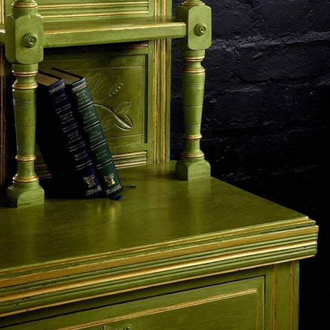 green dresser with gold accents