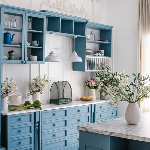 white kitchen with blue cabinets