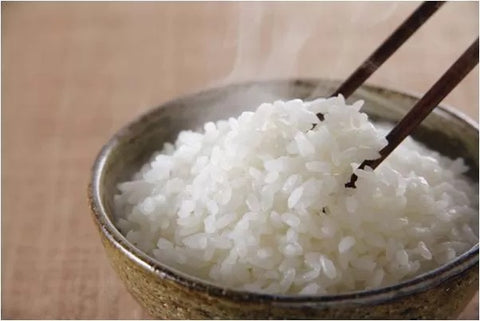 eat rice with chopsticks