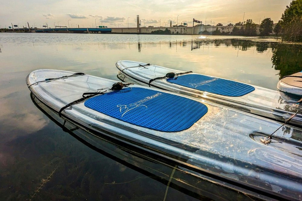 paddleboards on the water