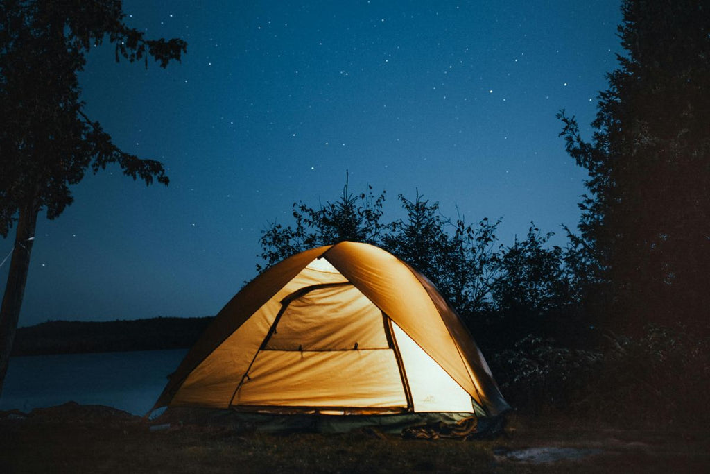 camping under the night sky