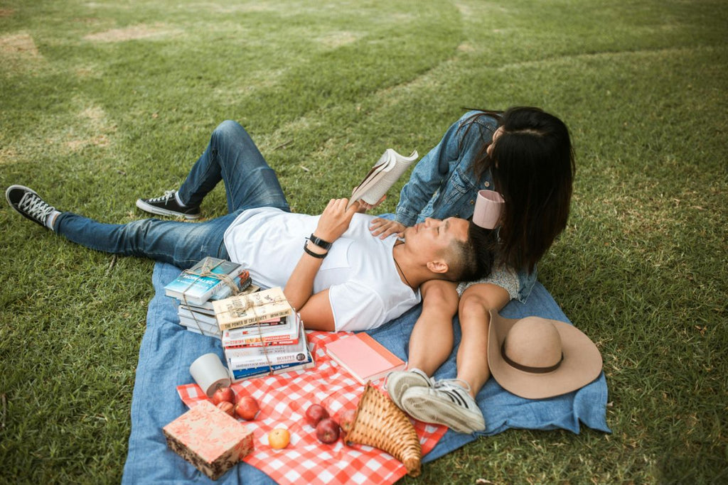 couple reading at a picnic