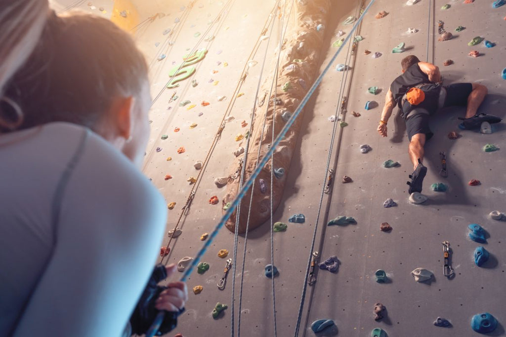 couple indoor rock climbing