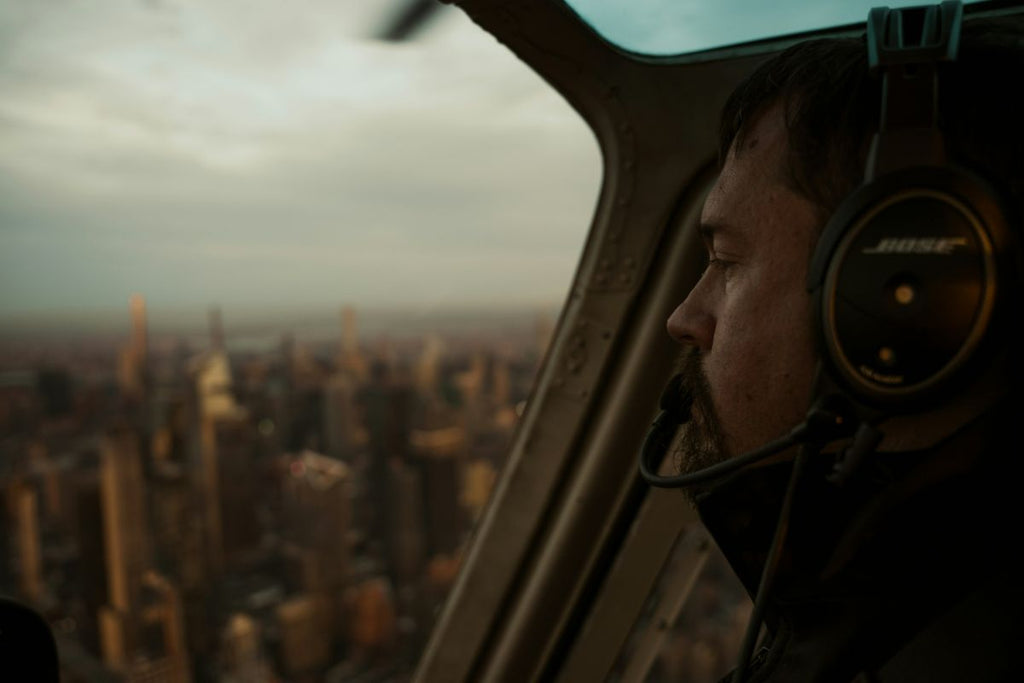 man in helicopter overlooking nyc