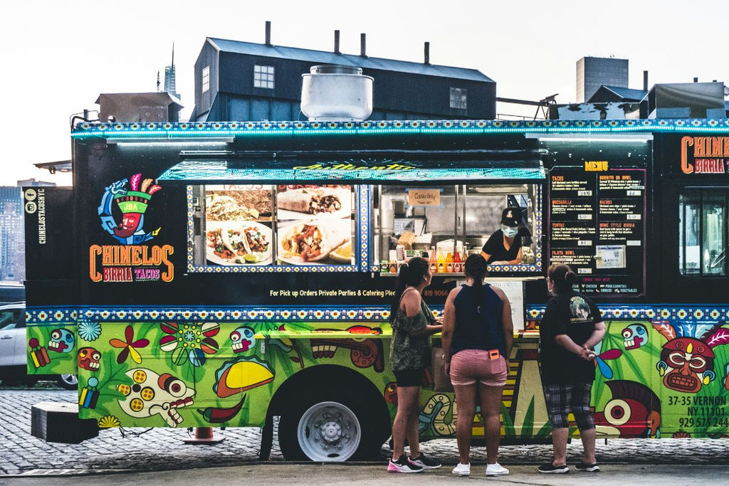 people ordering food at mexican food truck
