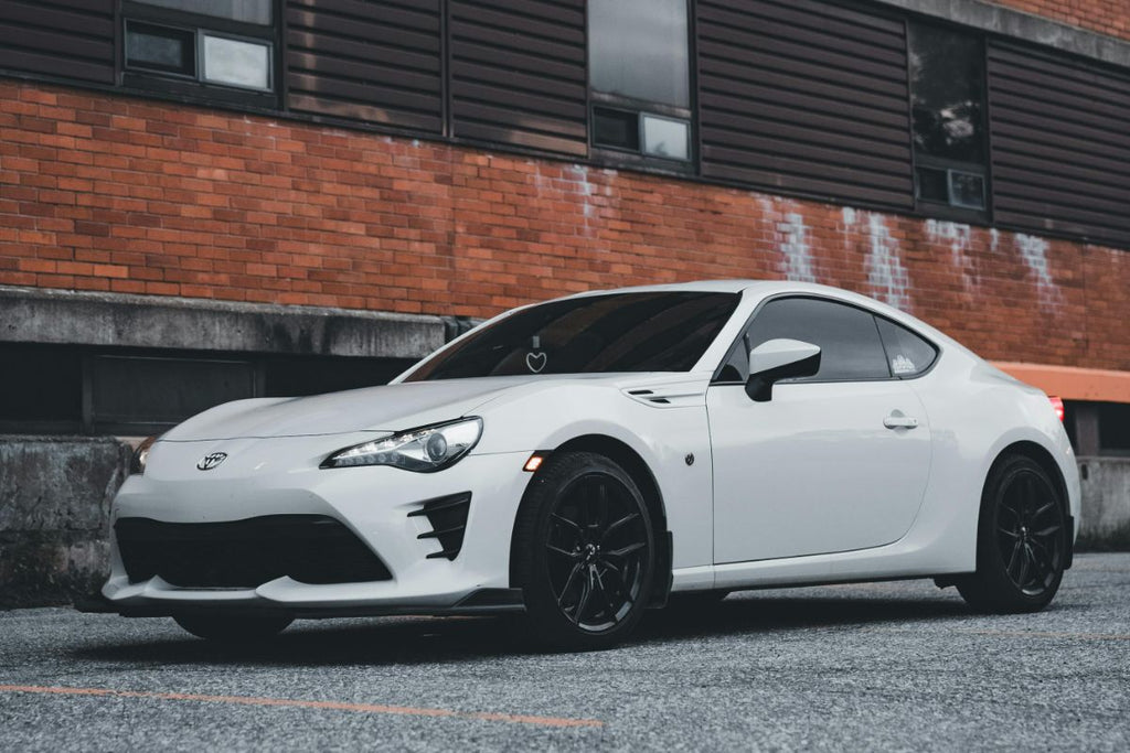 white sports car parked up