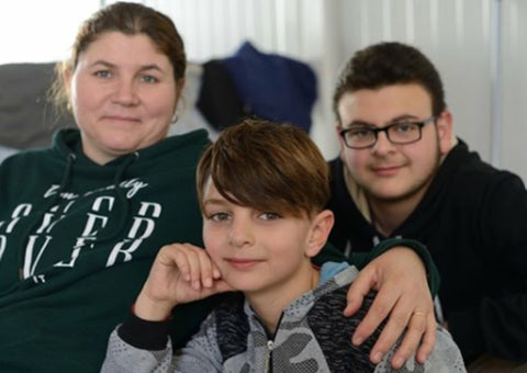 Thaura & her children in the camp 