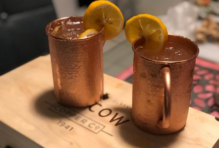 pair of copper mugs