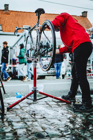 Person washing bicycle.