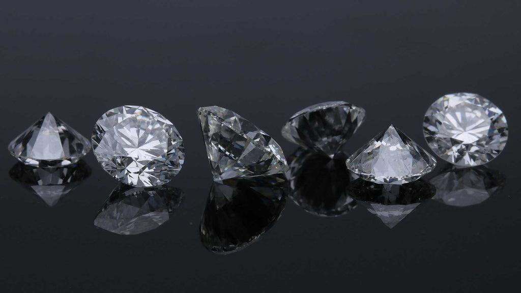 Multiple Diamond stones in a row on a table
