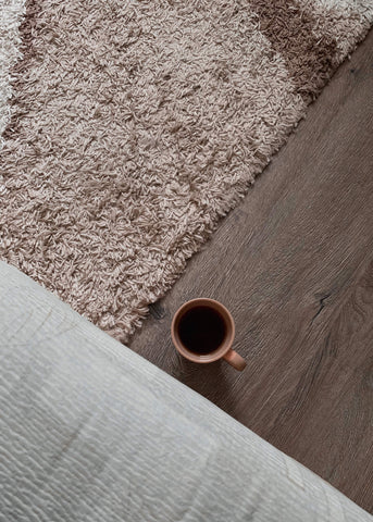 A brown shag rug providing inviting feel