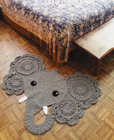 A small elephant rug adding a fun touch to the nursery room