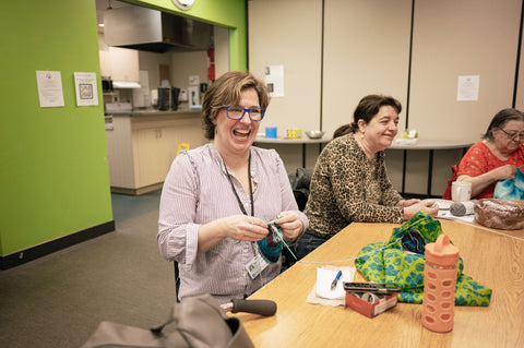 KCHC’s weekly Penguins group enjoying some crafting and togetherness. Photography by Liz Cooper Photography