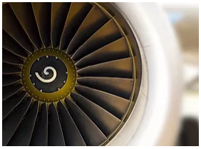 a close up of an airplane engine with a swirl on it