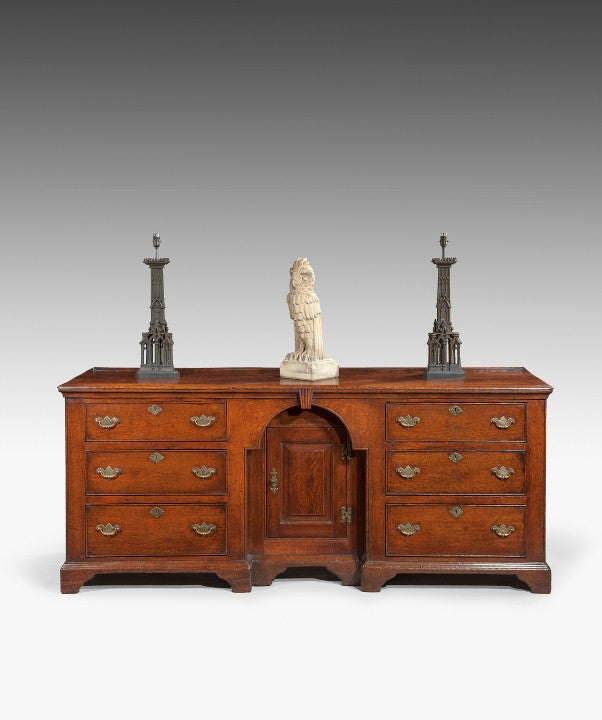 An antique oak cupboard base dresser.