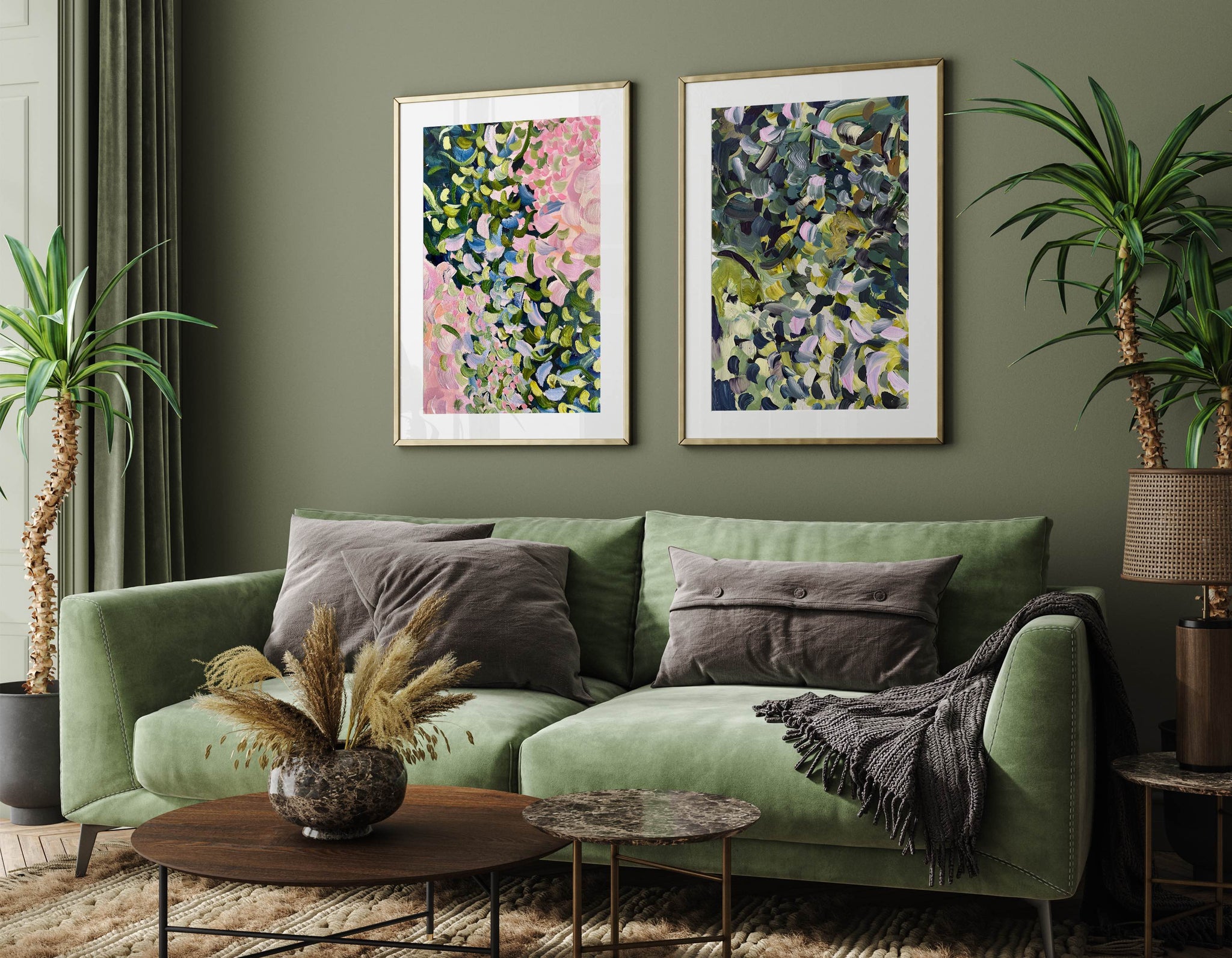 green interior with floral abstract prints above the sofa