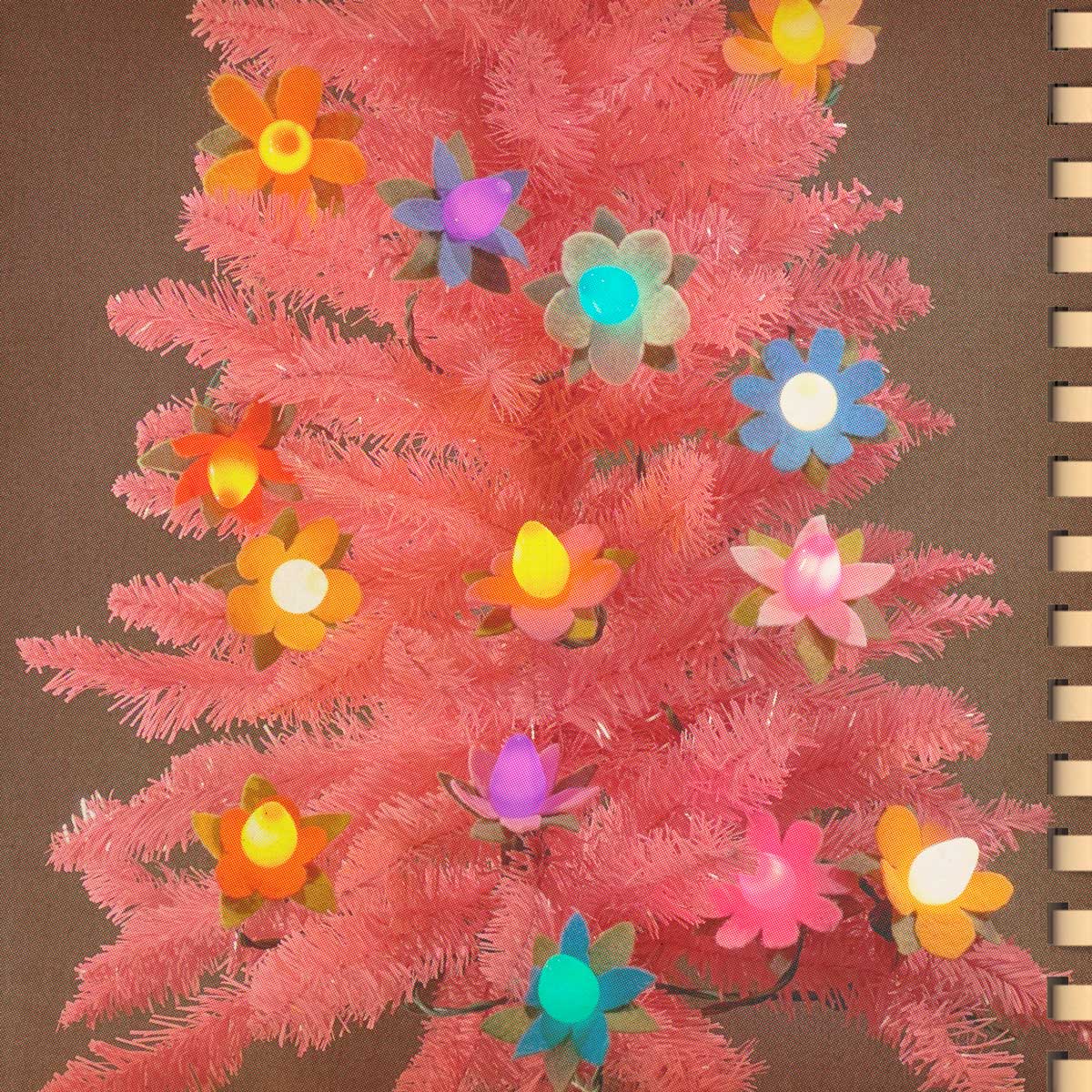Pink Christmas tree with vintage style lights and felt flower accessories