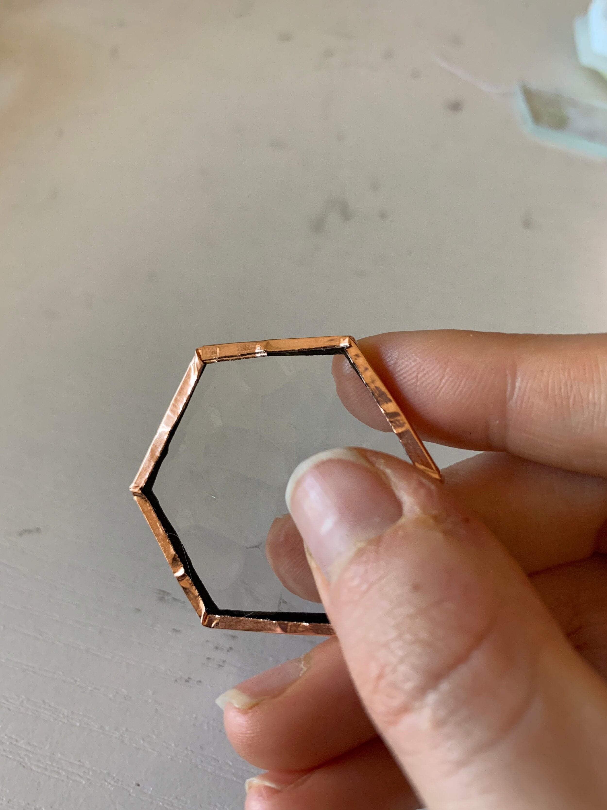 How likely is copper foil tape to hold up glass by itself? I keep seeing  artists using only copper tape, and SOMETIMES soldering just the corners to  attach hooks. Sometimes no solder