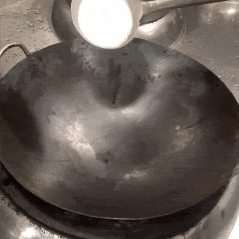 salt scrubbing the wok