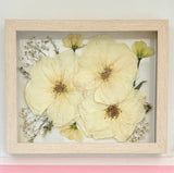 small pressed rose bouquet in natural wood frame