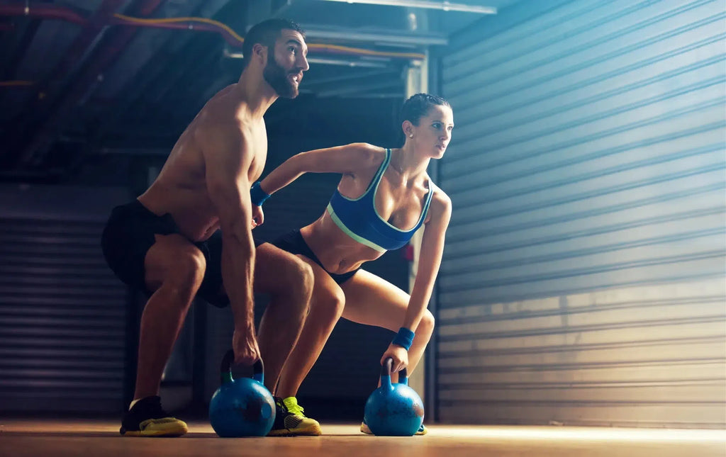 Duo doing a kettlebell workout