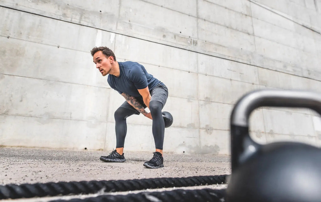 Man doing a kettlebell swing