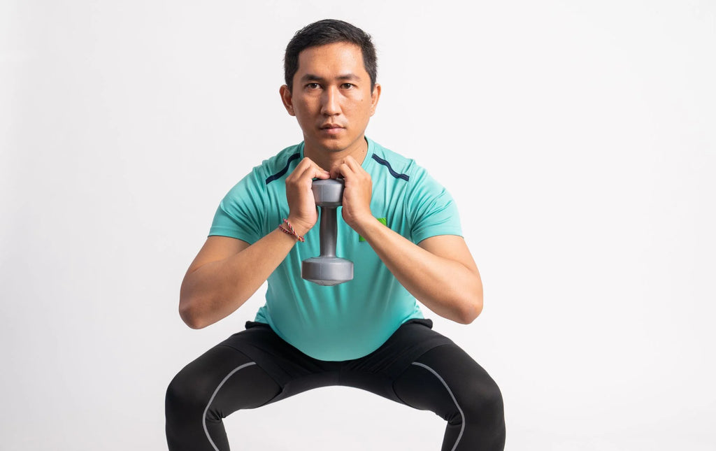 Man doing dumbbell front squat