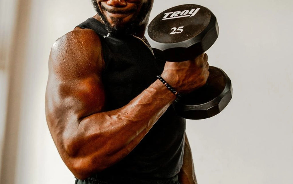 black male doing bicep curl with urethane 12-sided dumbbell