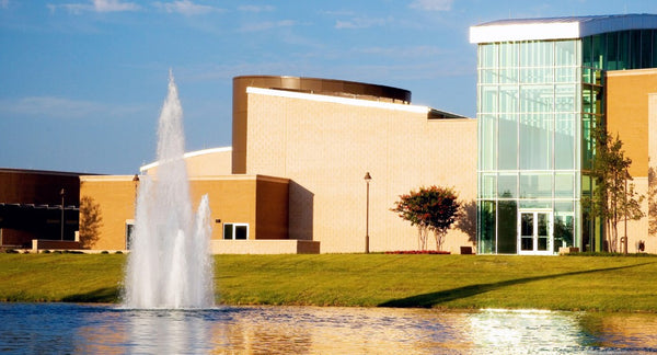 Vertex MultiGeyser Floating Pond Fountain - On Water with Structures at the Background