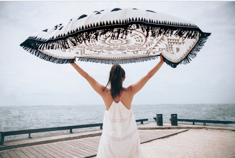 Girl holding a flying blanket.