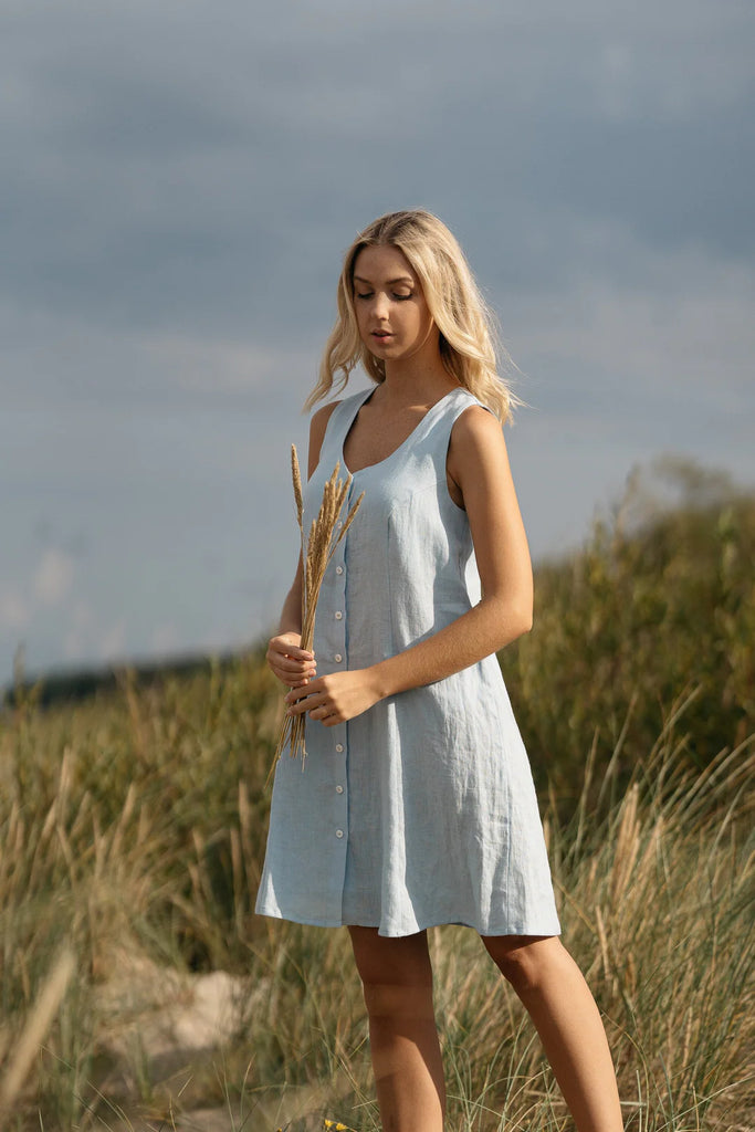 women wears buttoned linen dress