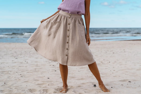 Model wears linen maternity skirt in beach