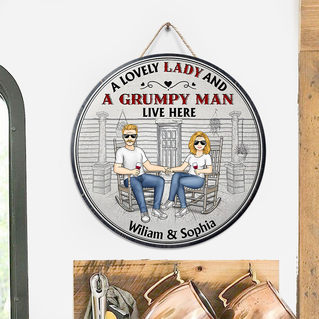 A Lovely Lady And A Grumpy Old Man Live Here - Personalized Couple Round Wood Sign