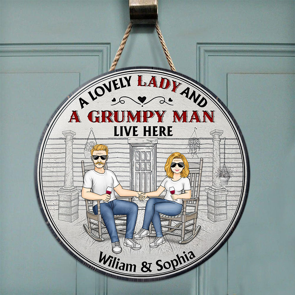 A Lovely Lady And A Grumpy Old Man Live Here - Personalized Couple Round Wood Sign