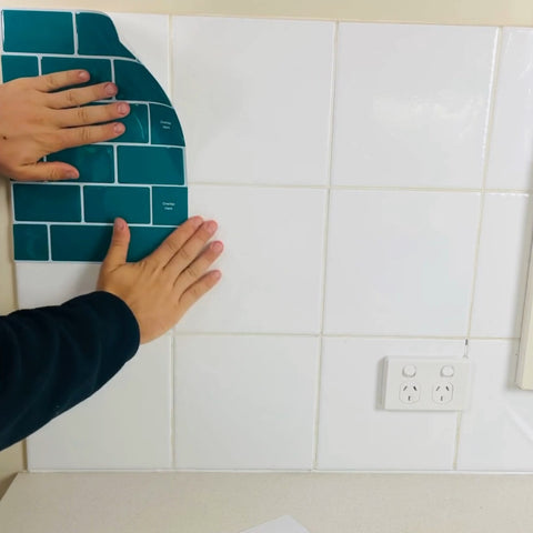 applying first stick on tile