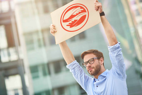 hygiene revolution - man holding sign with water wise soap logo