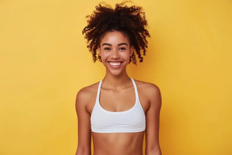 A healthy young woman in gym gear about to exercise